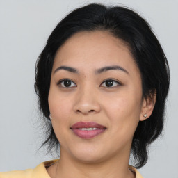 Joyful asian young-adult female with medium  black hair and brown eyes