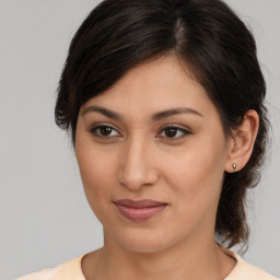 Joyful white young-adult female with medium  brown hair and brown eyes