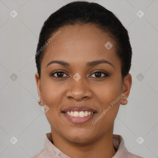 Joyful black young-adult female with short  black hair and brown eyes