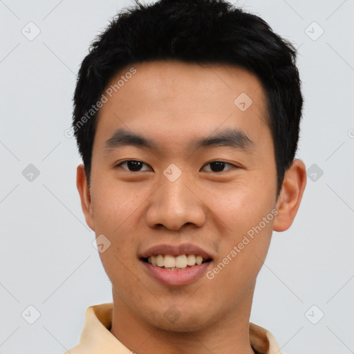 Joyful asian young-adult male with short  black hair and brown eyes