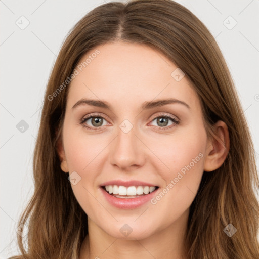 Joyful white young-adult female with long  brown hair and green eyes