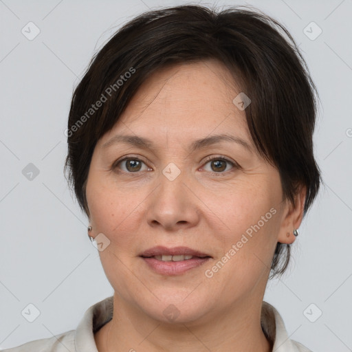 Joyful white adult female with medium  brown hair and brown eyes