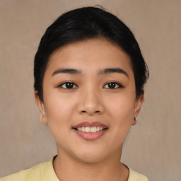 Joyful asian young-adult female with short  black hair and brown eyes