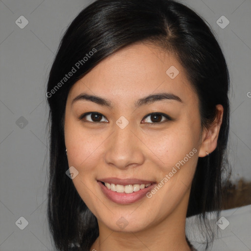 Joyful asian young-adult female with medium  brown hair and brown eyes