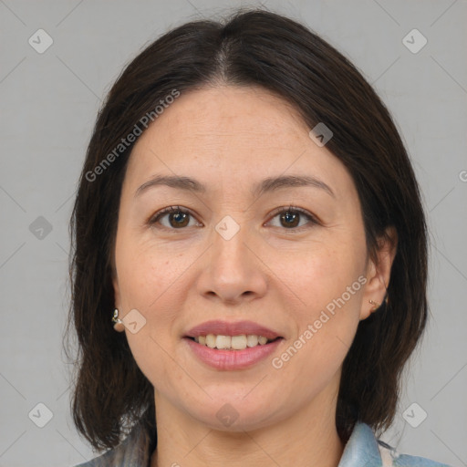 Joyful white adult female with medium  brown hair and brown eyes