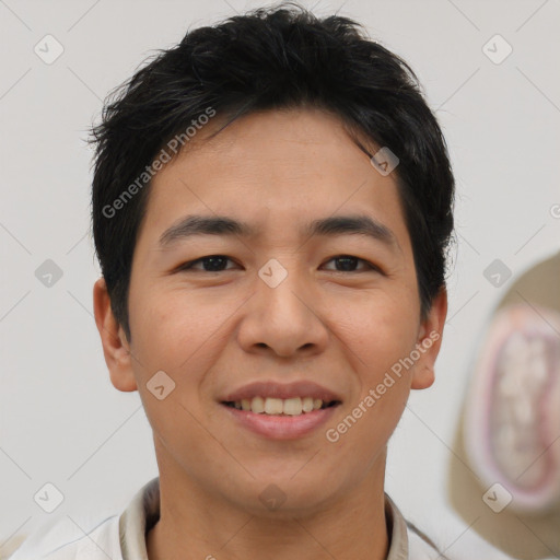 Joyful asian young-adult male with short  brown hair and brown eyes