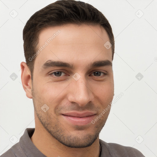 Joyful white young-adult male with short  brown hair and brown eyes