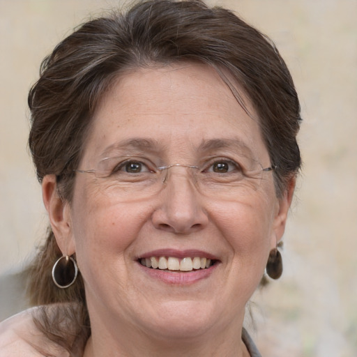 Joyful white middle-aged female with medium  brown hair and brown eyes