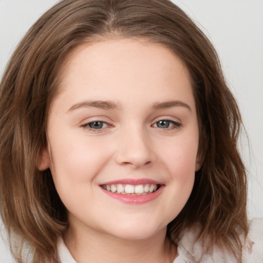 Joyful white child female with medium  brown hair and brown eyes