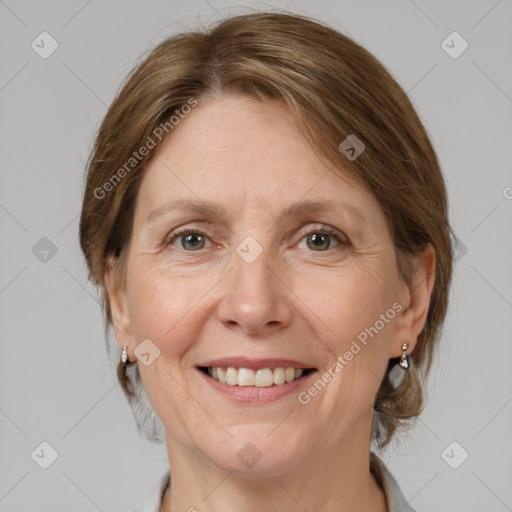 Joyful white adult female with medium  brown hair and grey eyes