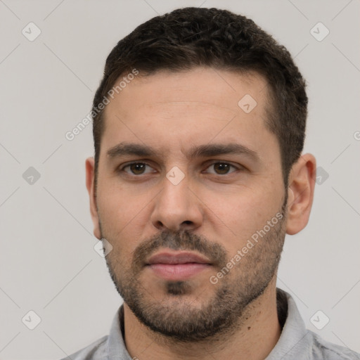 Neutral white young-adult male with short  black hair and brown eyes