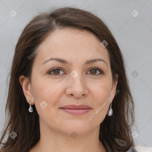 Joyful white adult female with long  brown hair and brown eyes