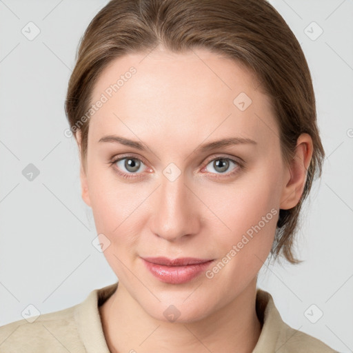 Joyful white young-adult female with medium  brown hair and blue eyes