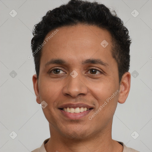 Joyful latino young-adult male with short  black hair and brown eyes