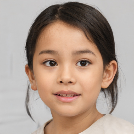 Joyful asian child female with medium  brown hair and brown eyes