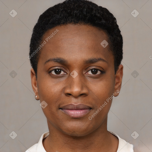 Joyful black young-adult female with short  black hair and brown eyes