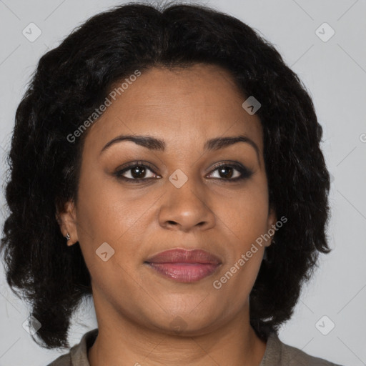 Joyful black adult female with medium  brown hair and brown eyes