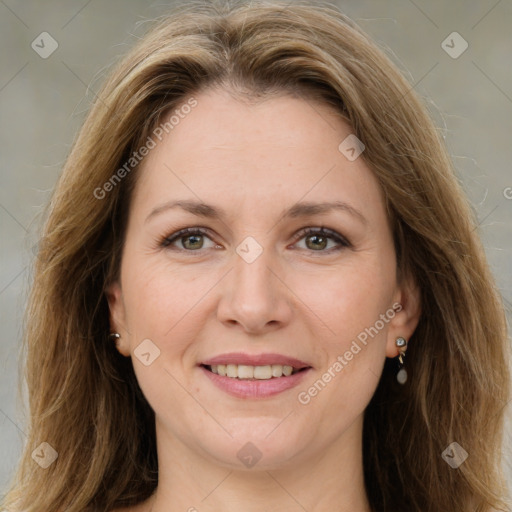 Joyful white adult female with long  brown hair and brown eyes