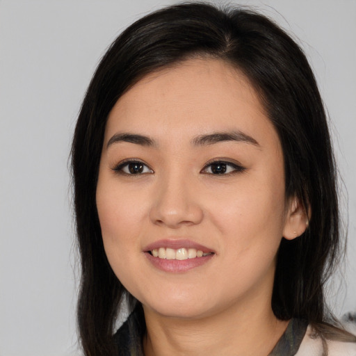 Joyful asian young-adult female with medium  brown hair and brown eyes