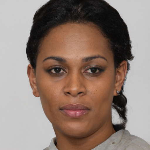Neutral latino adult female with short  black hair and brown eyes