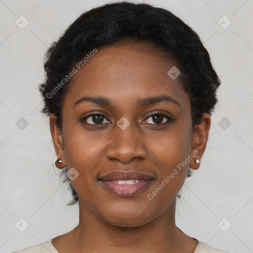 Joyful black young-adult female with short  black hair and brown eyes