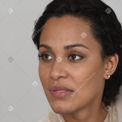 Joyful latino young-adult female with short  black hair and brown eyes