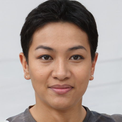 Joyful asian young-adult female with short  brown hair and brown eyes
