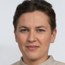 Joyful white adult female with short  brown hair and brown eyes