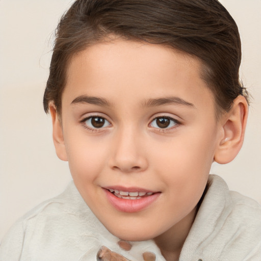 Joyful white child female with short  brown hair and brown eyes