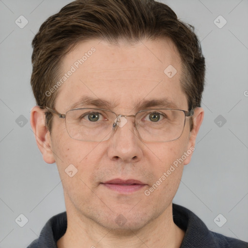 Joyful white adult male with short  brown hair and grey eyes