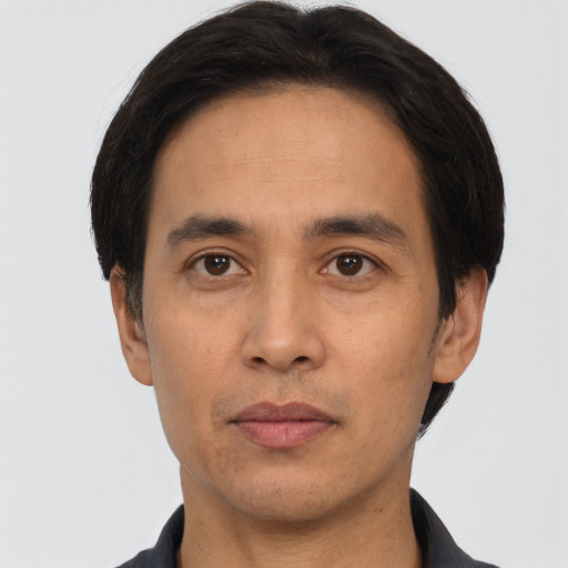 Neutral asian adult male with short  black hair and brown eyes