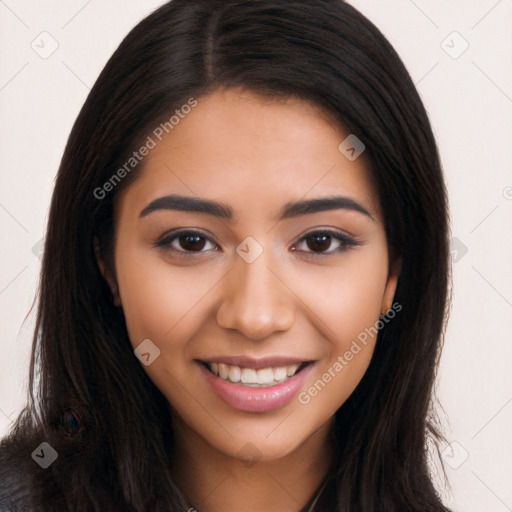 Joyful latino young-adult female with long  brown hair and brown eyes