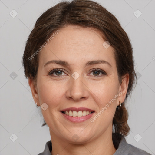 Joyful white adult female with medium  brown hair and grey eyes