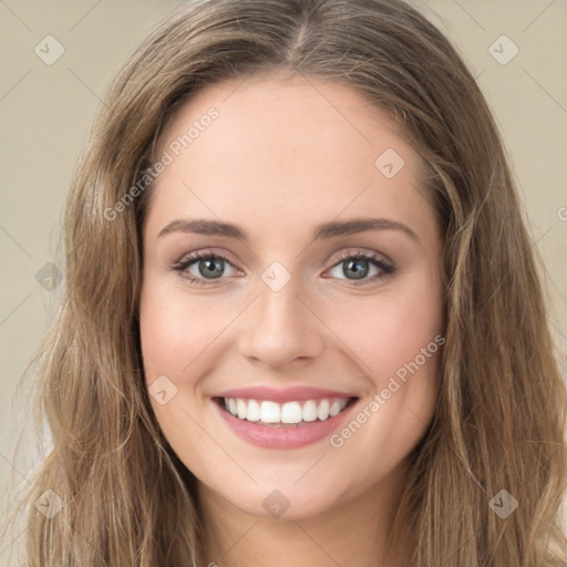 Joyful white young-adult female with long  brown hair and green eyes