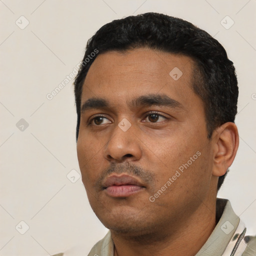 Neutral latino young-adult male with short  black hair and brown eyes