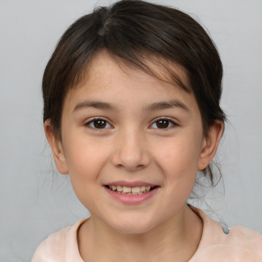 Joyful white child female with medium  brown hair and brown eyes