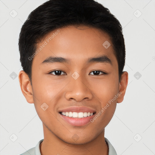 Joyful latino young-adult male with short  brown hair and brown eyes