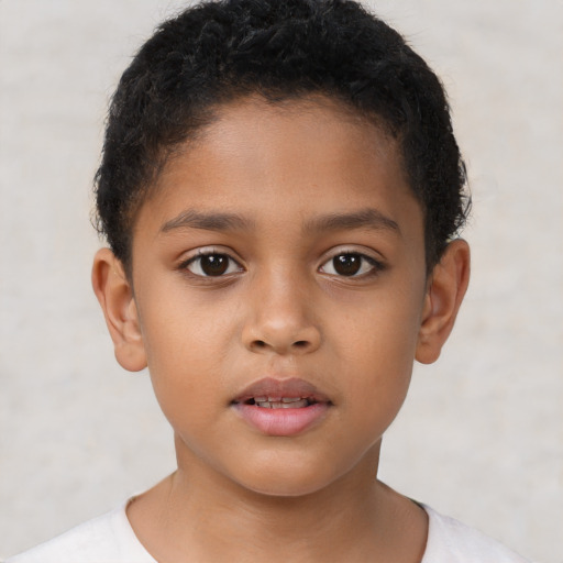 Neutral latino child male with short  brown hair and brown eyes