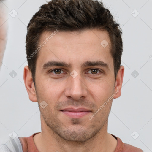 Joyful white young-adult male with short  brown hair and brown eyes