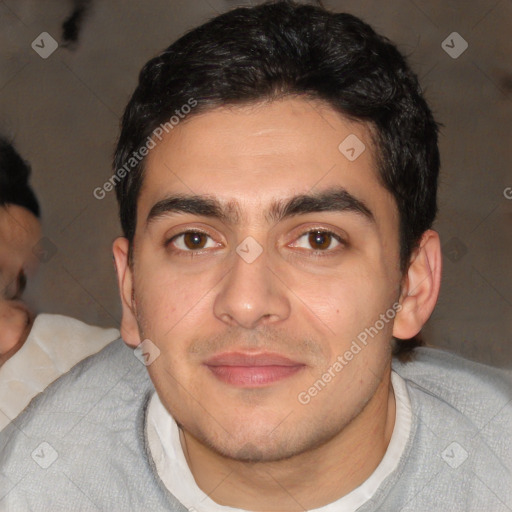 Joyful white young-adult male with short  black hair and brown eyes