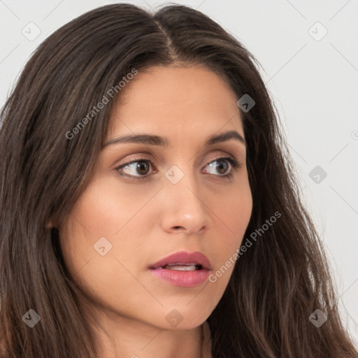 Neutral white young-adult female with long  brown hair and brown eyes