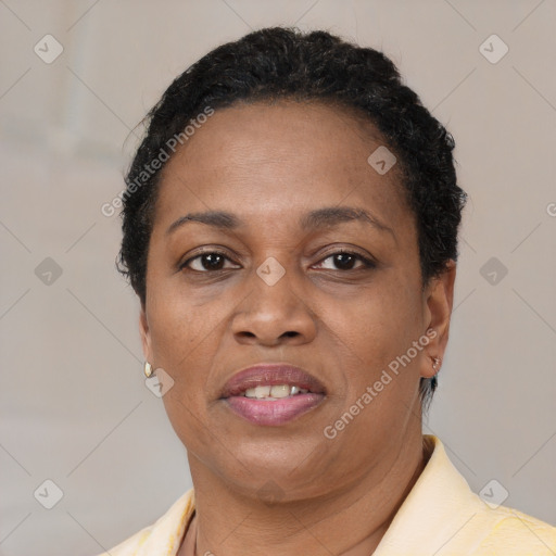 Joyful black adult female with short  brown hair and brown eyes