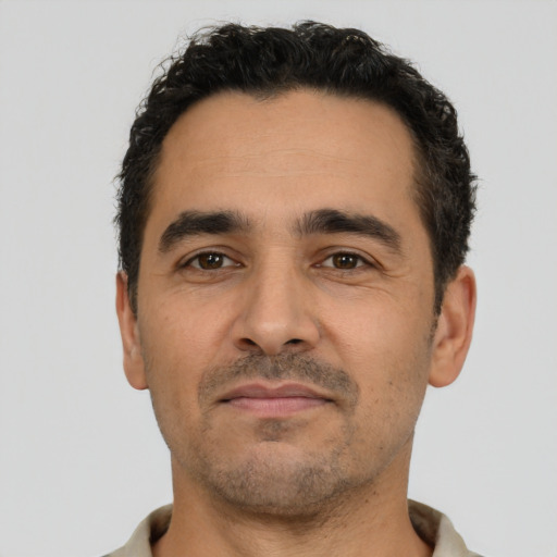 Neutral latino adult male with short  black hair and brown eyes