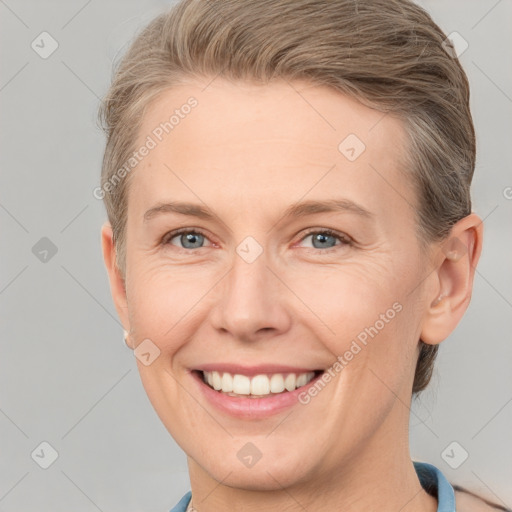 Joyful white adult female with short  brown hair and grey eyes