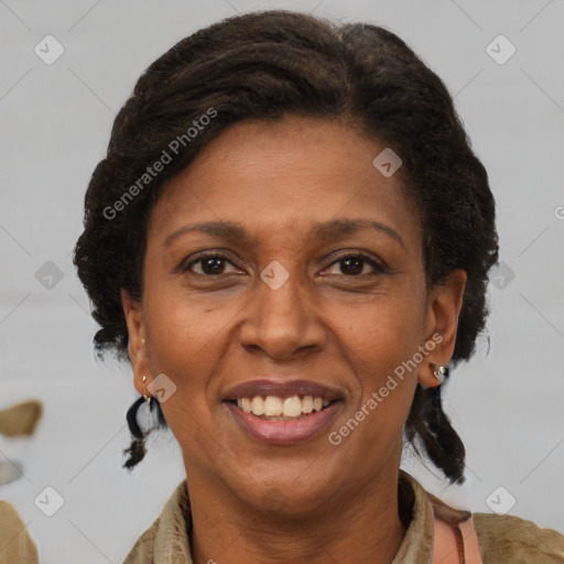 Joyful black adult female with medium  brown hair and brown eyes