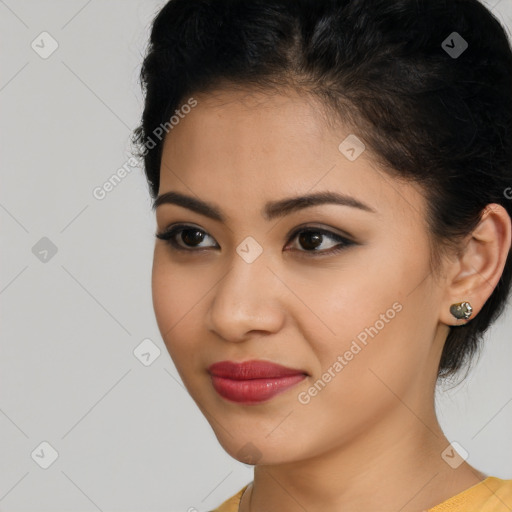 Joyful latino young-adult female with short  brown hair and brown eyes