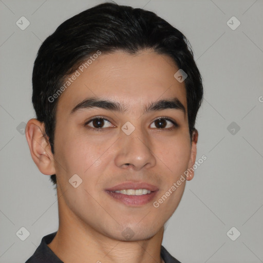 Joyful white young-adult male with short  black hair and brown eyes