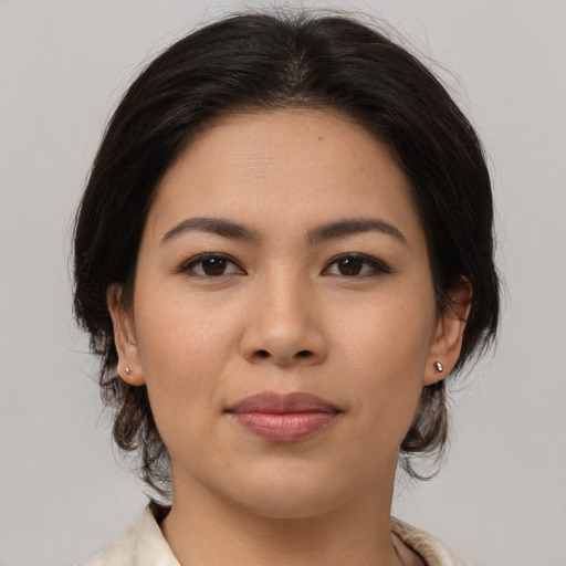 Joyful asian young-adult female with medium  brown hair and brown eyes