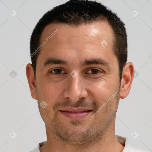 Joyful white young-adult male with short  brown hair and brown eyes