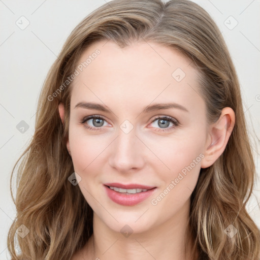 Joyful white young-adult female with long  brown hair and blue eyes